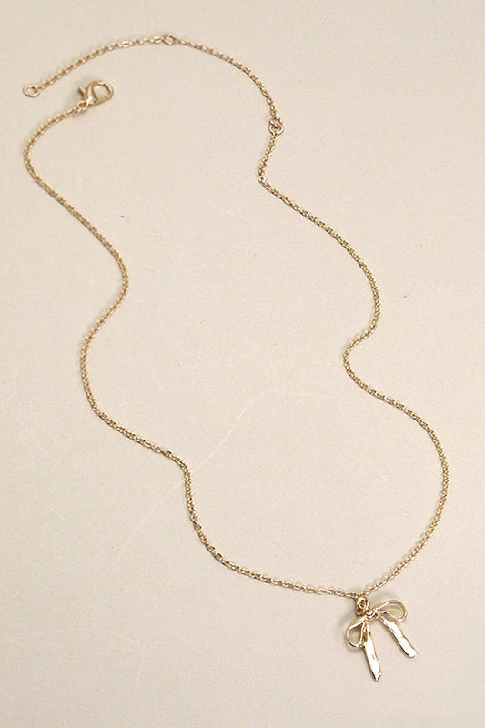 THE BOW PENDANT NECKLACE IN GOLD