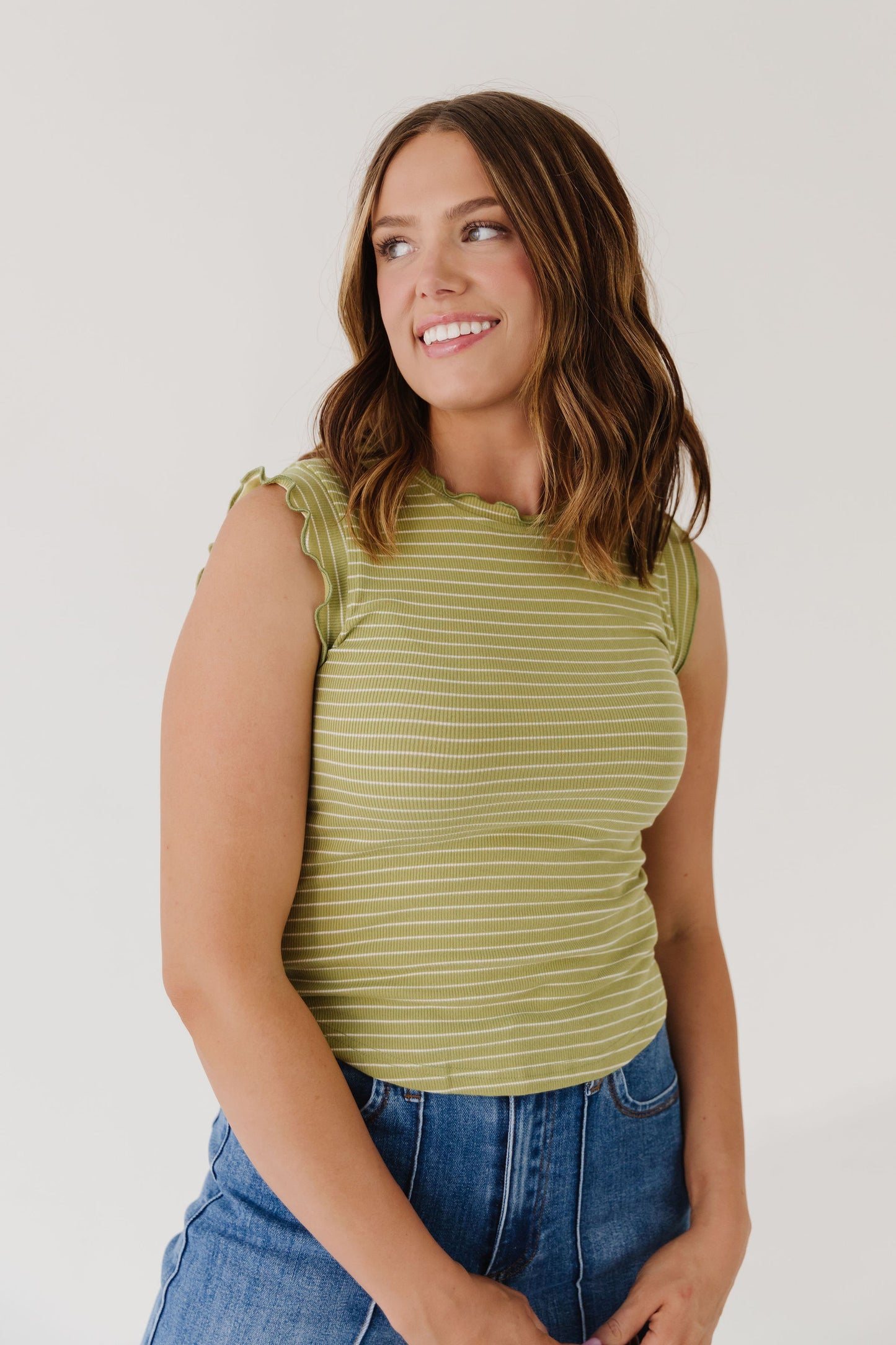 THE ALEXIS FRILL TANK IN GREEN