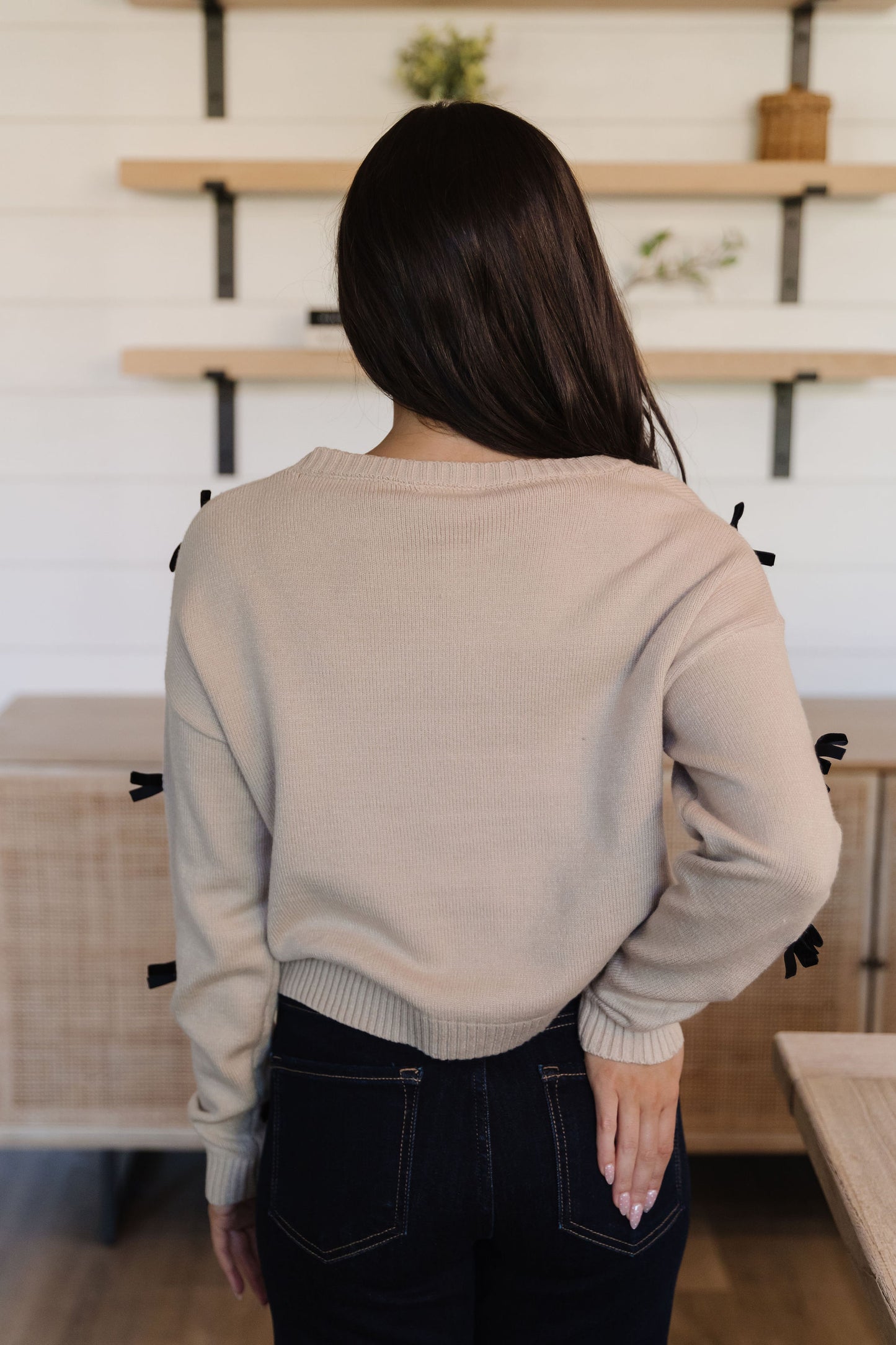 THE PENELOPE BOW SWEATER IN CREAM