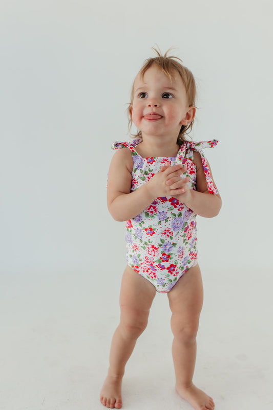 GIRLS TIE STRAP ONE PIECE IN CORAL BLOSSOM BY PINK DESERT X SARAH TRIPP