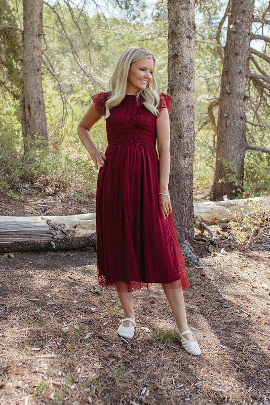 THE SEVYN POLKA DOT MIDI SMOCKED DRESS IN BURGUNDY