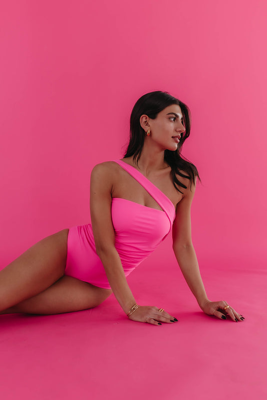 ASYMMETRICAL STRAP ONE PIECE IN ELECTRIC PINK BY PINK DESERT