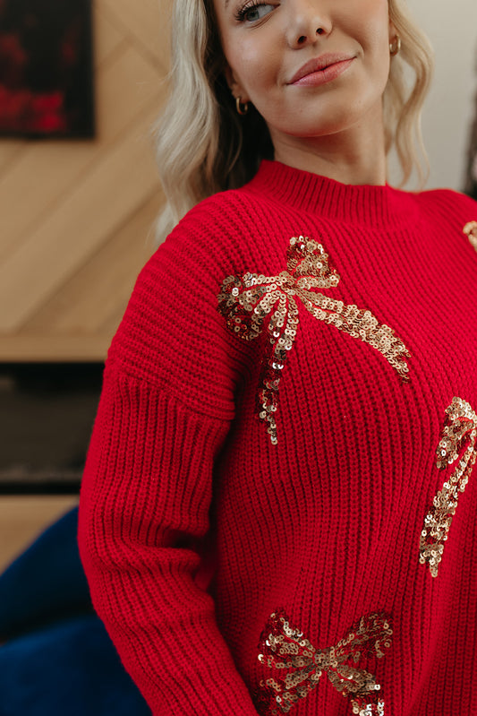 THE ABIGAIL SEQUIN BOWS HOLIDAY SWEATER IN RED