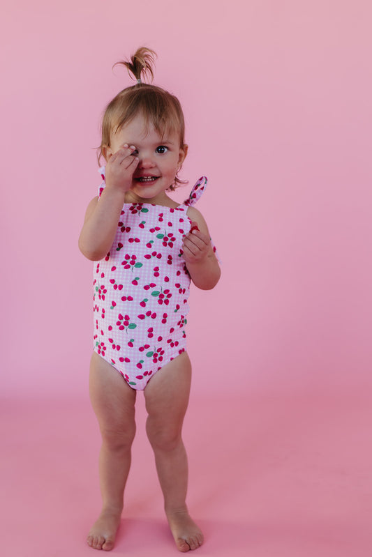 GIRLS TIE STRAP ONE PIECE IN ROSIE RASPBERRY BY PINK DESERT