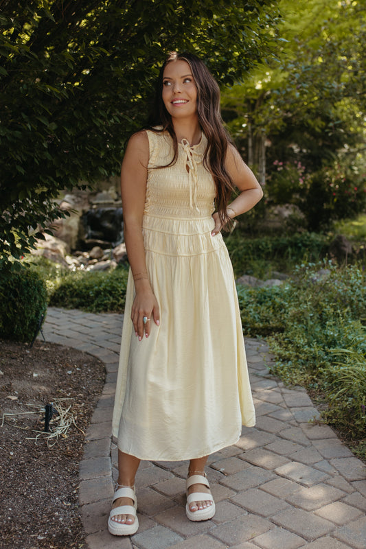 THE ROBIN FRONT TIE SMOCKED DRESS IN YELLOW