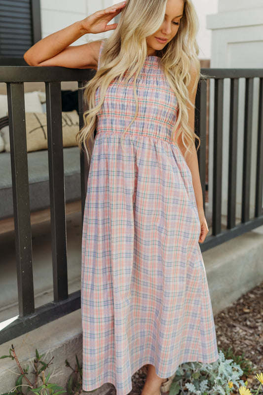 THE SAVANNAH SMOCKED PLAID DRESS IN CORAL