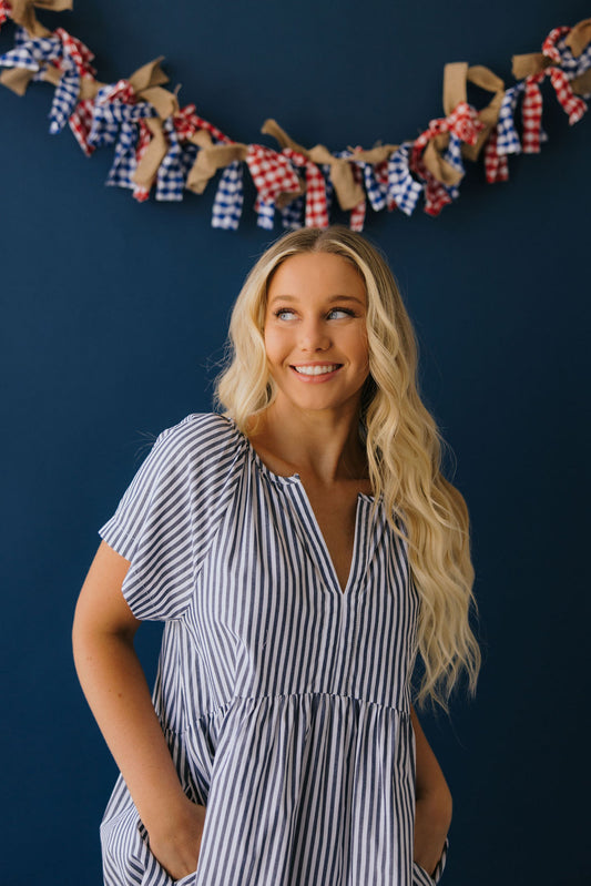 THE ABBY STRIPED BABYDOLL DRESS IN BLUE