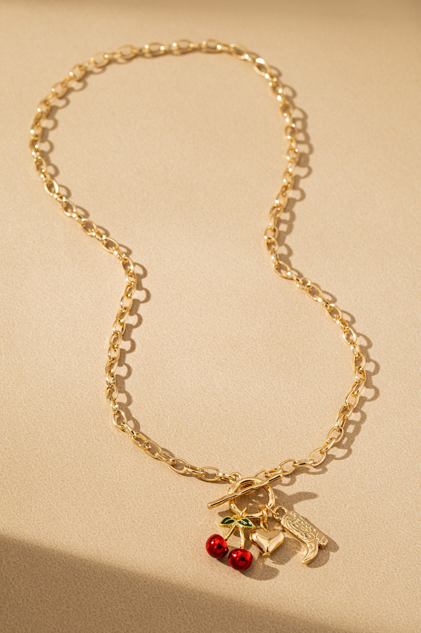 THE CHERRY CRUSH CHARM NECKLACE IN GOLD