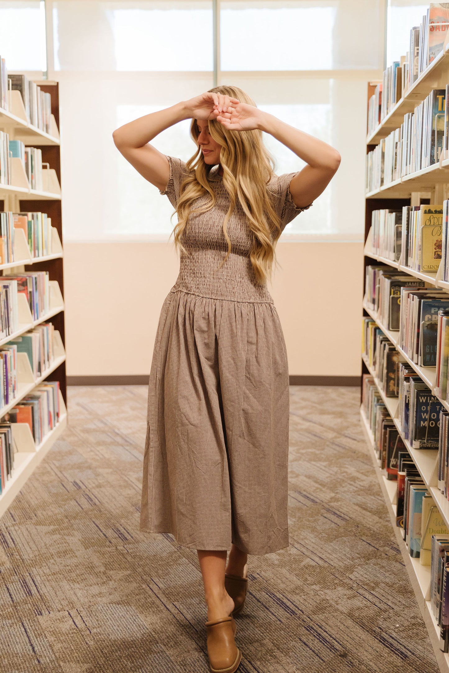 THE LANEY SMOCKED GINGHAM MIDI DRESS IN BROWN