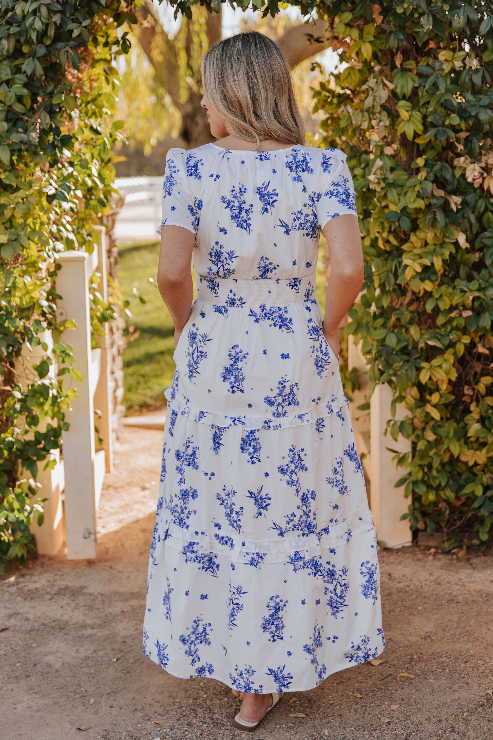 THE PALMER POPLIN DRESS IN BLUE FLORAL Pink Desert THE PALMER POPLIN DRESS IN BLUE FLORAL Pink Desert