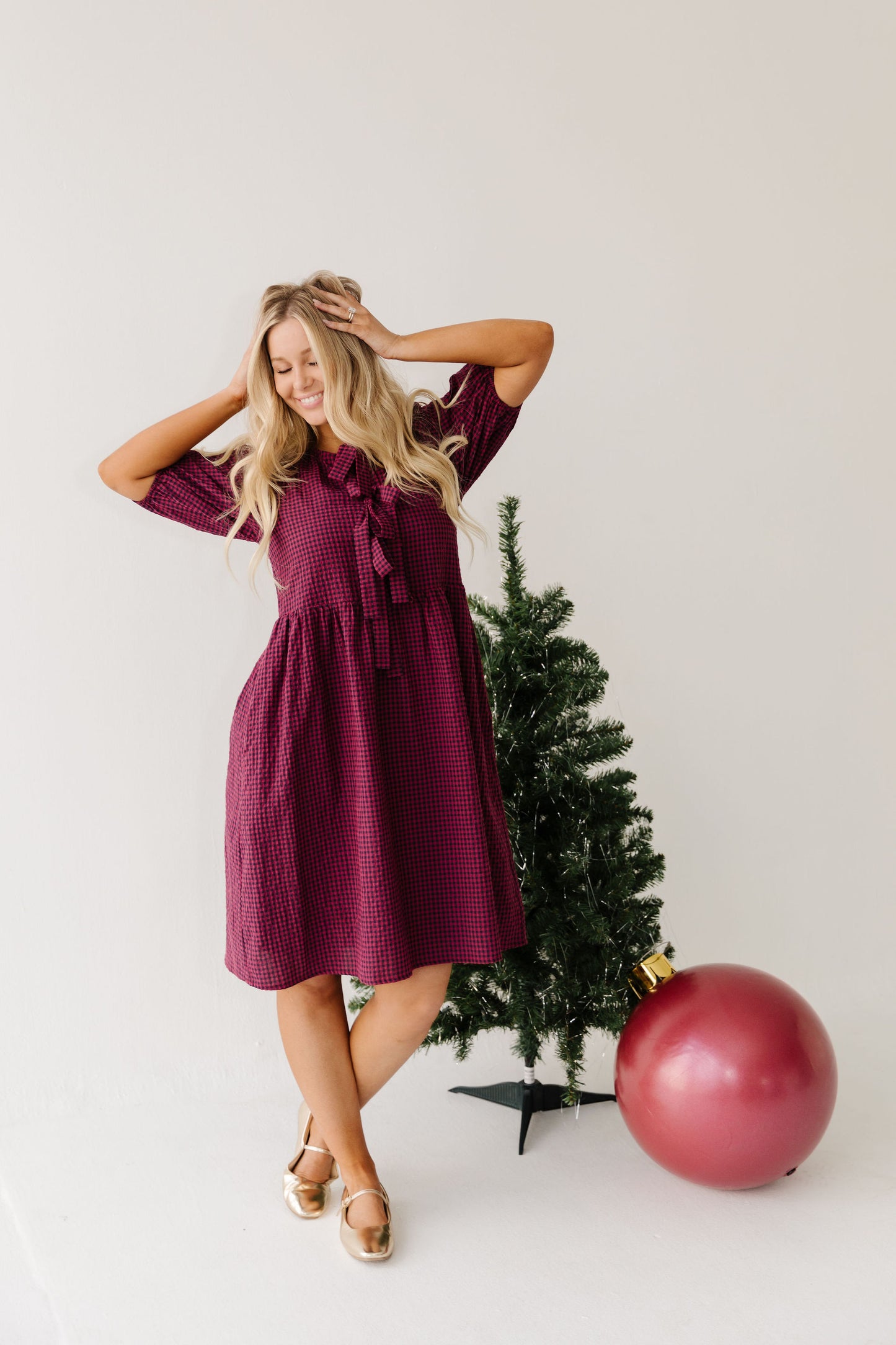 THE HARLOW BOW DRESS IN BURGUNDY CHECKERED BY PINK DESERT