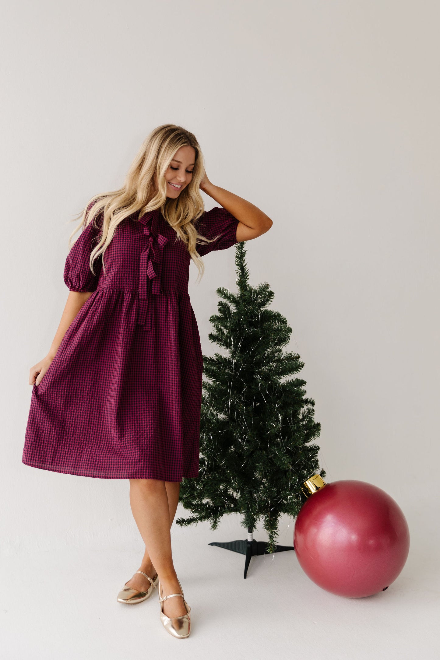 THE HARLOW BOW DRESS IN BURGUNDY CHECKERED BY PINK DESERT