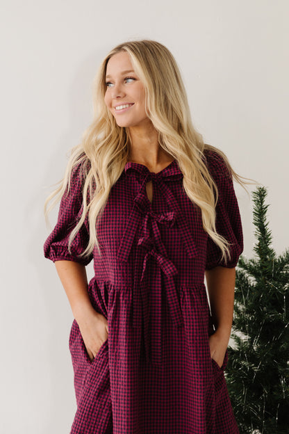 THE HARLOW BOW DRESS IN BURGUNDY CHECKERED BY PINK DESERT