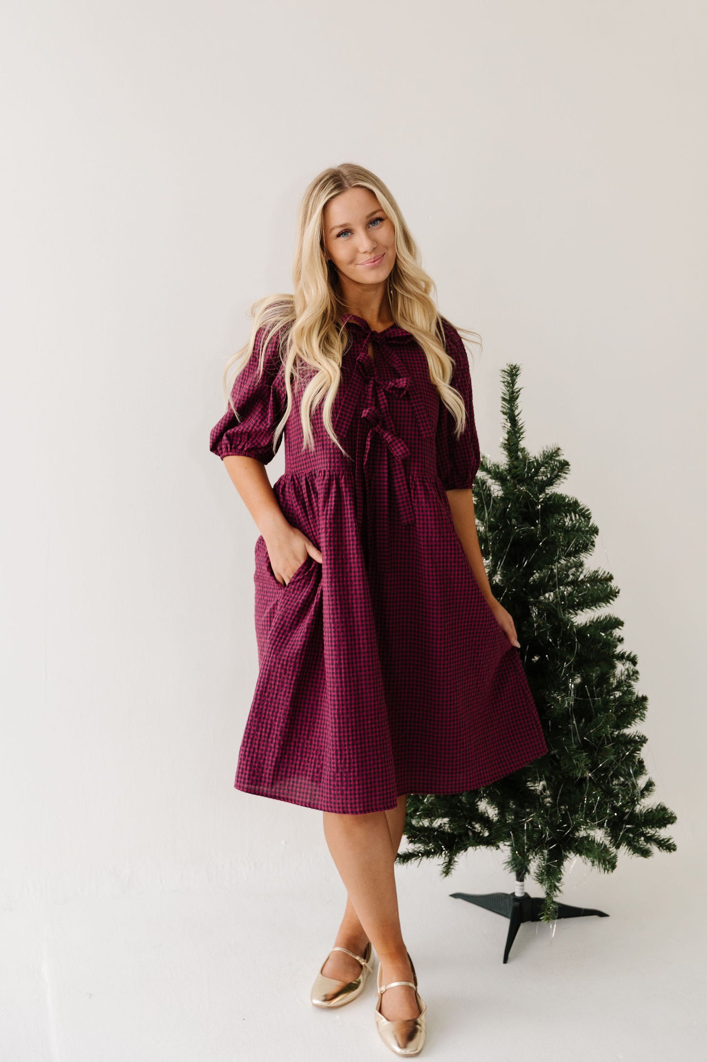 THE HARLOW BOW DRESS IN BURGUNDY CHECKERED BY PINK DESERT