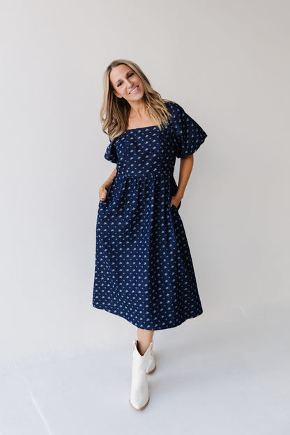 THE MAKENZIE FLORAL JACQUARD DENIM DRESS IN BLUE