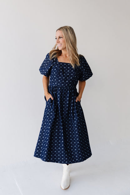 THE MAKENZIE FLORAL JACQUARD DENIM DRESS IN BLUE