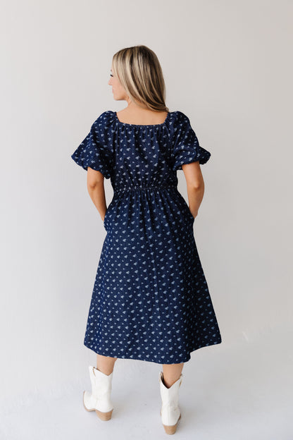 THE MAKENZIE FLORAL JACQUARD DENIM DRESS IN BLUE