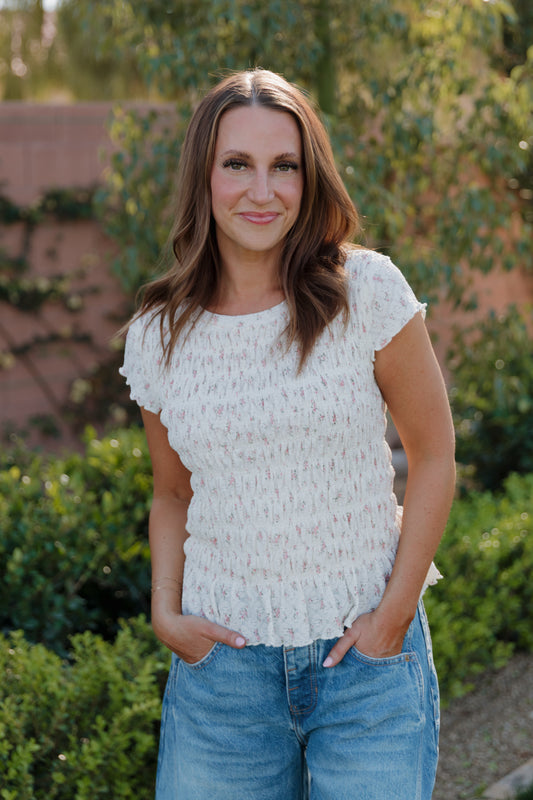 THE MADISON SMOCKED FLORAL TOP IN CREAM