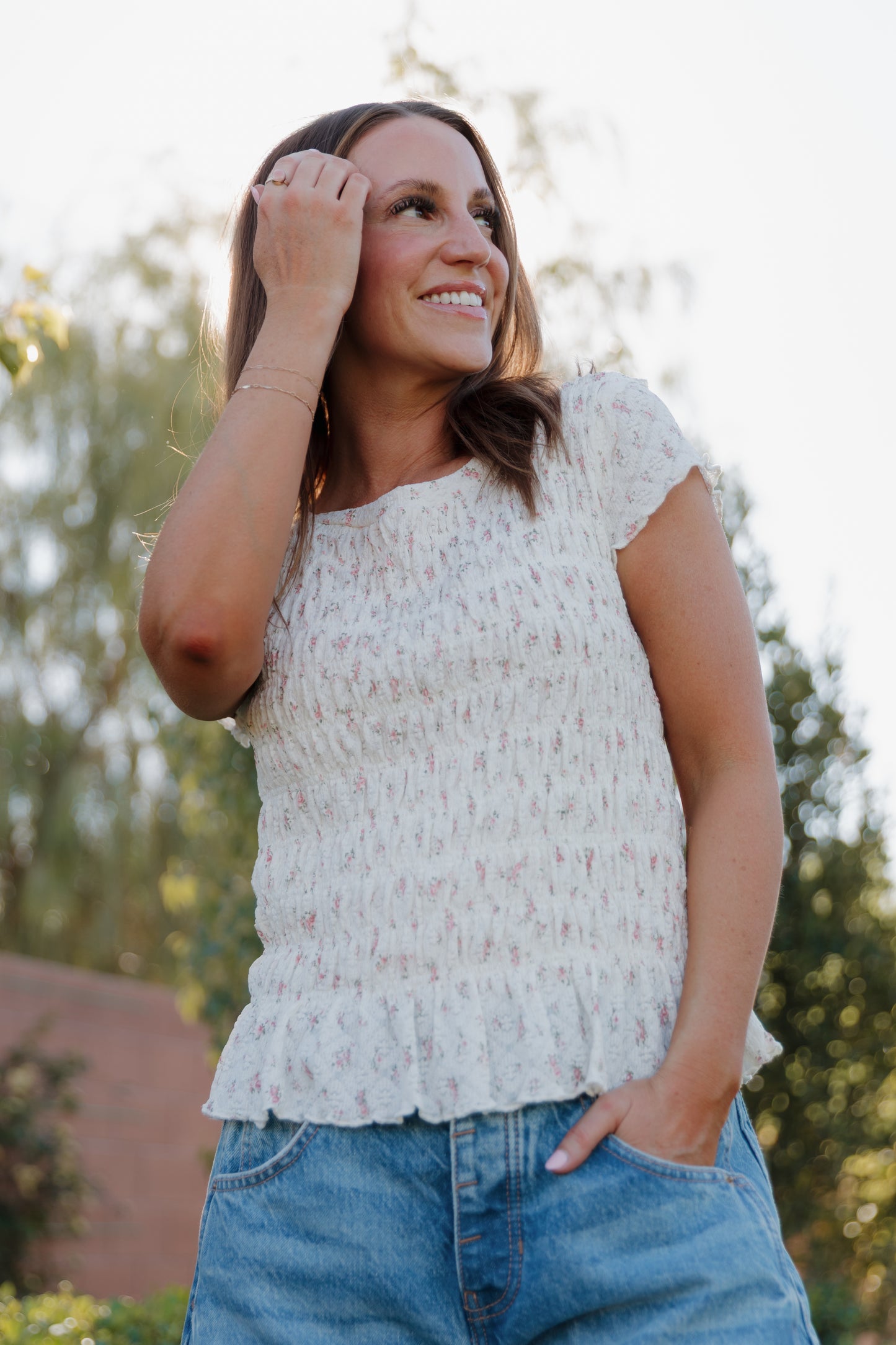 THE MADISON SMOCKED FLORAL TOP IN CREAM