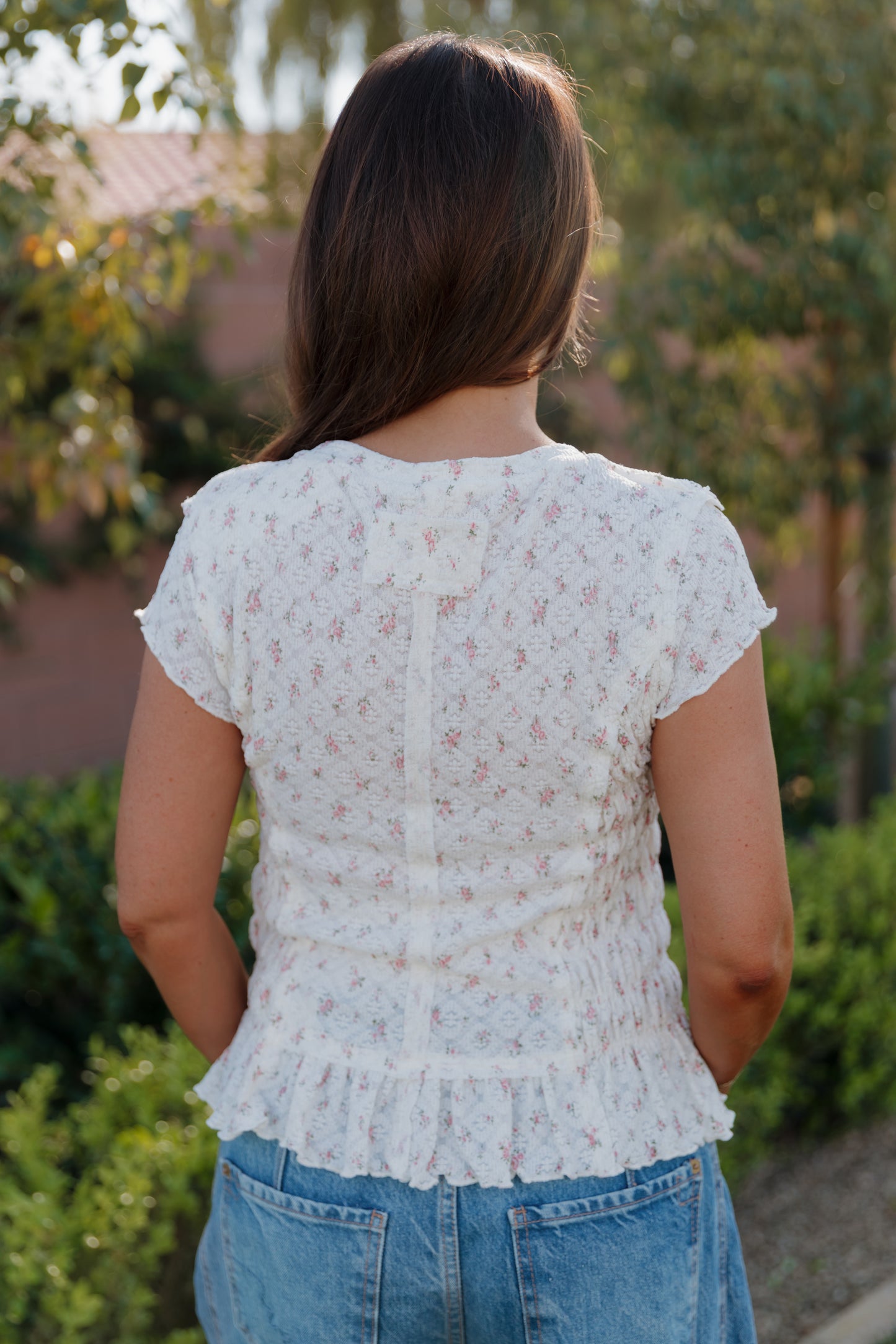 THE MADISON SMOCKED FLORAL TOP IN CREAM