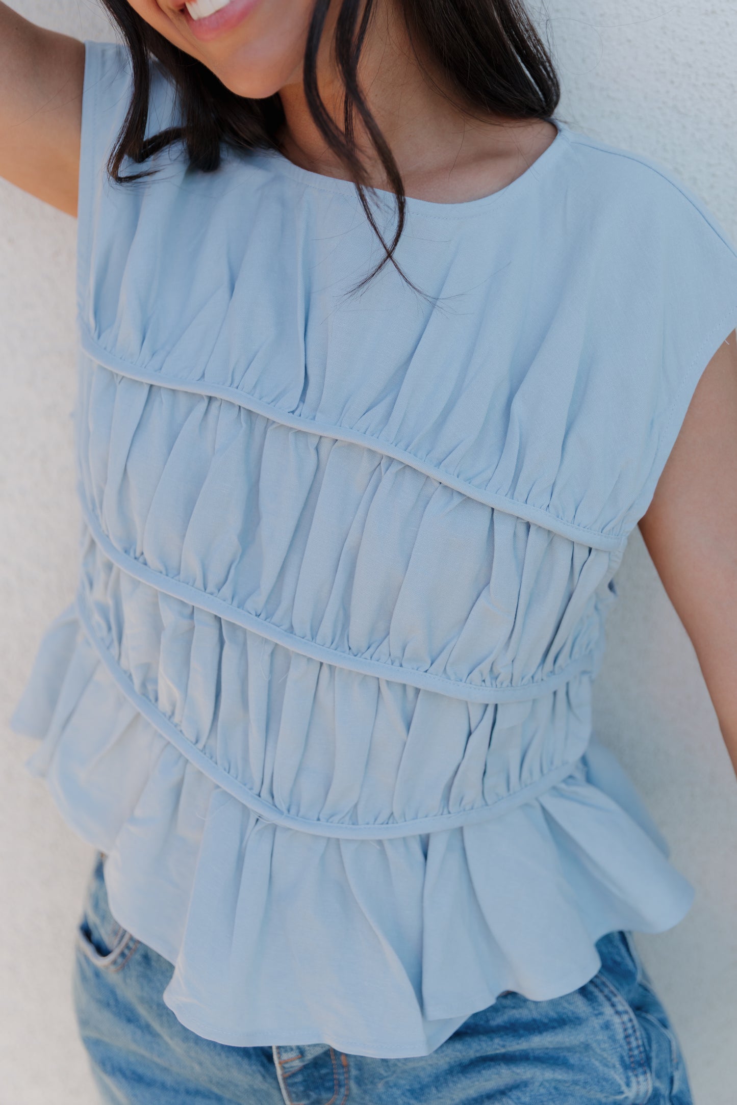 THE ANDREA RUCHED PEPLUM TOP IN SKY BLUE