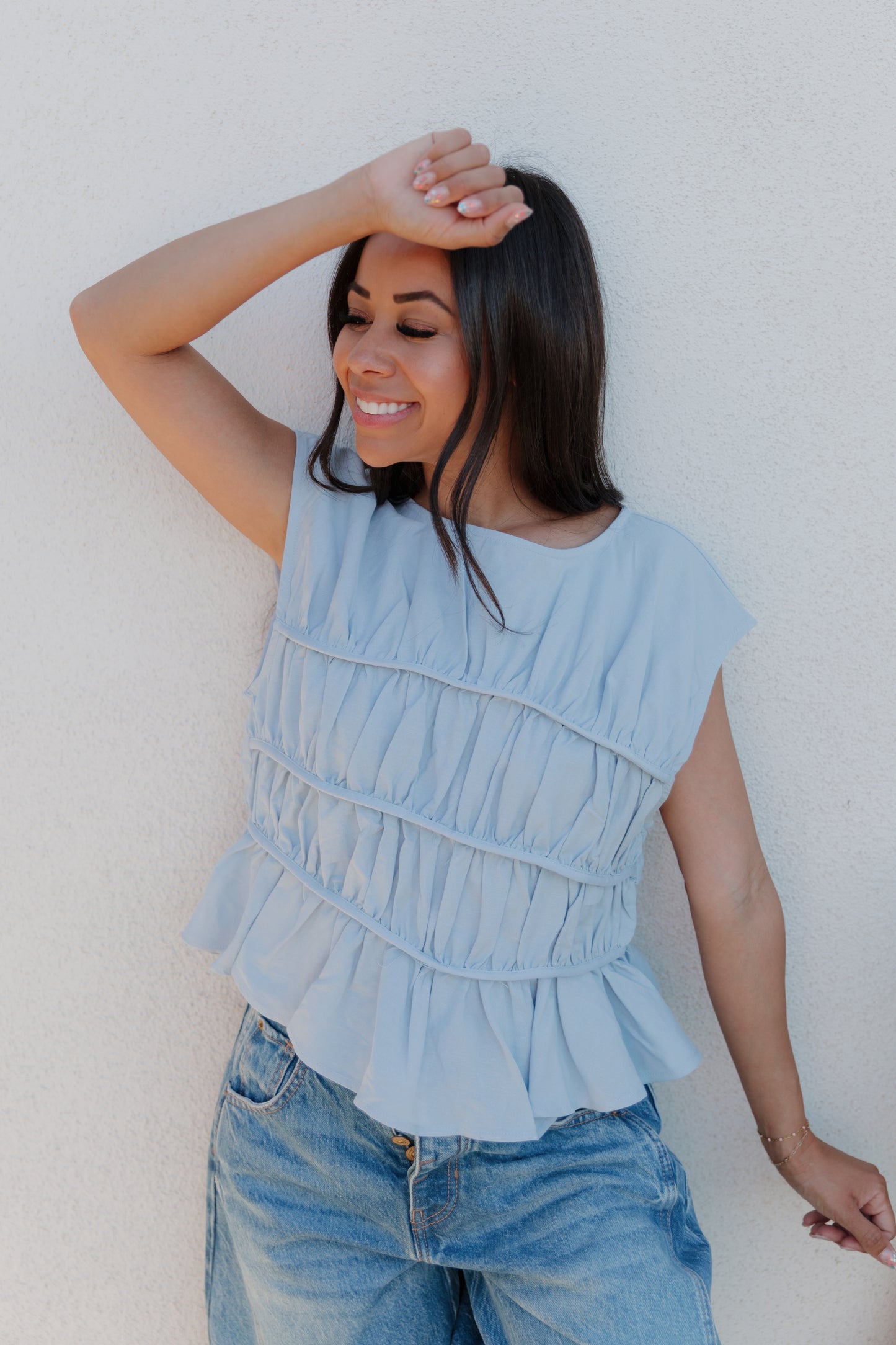 THE ANDREA RUCHED PEPLUM TOP IN SKY BLUE