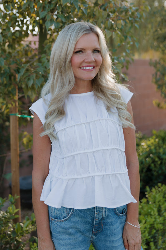 THE ANDREA RUCHED PEPLUM TOP IN WHITE