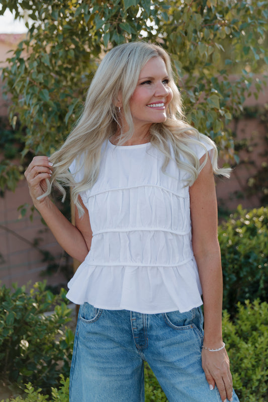 THE ANDREA RUCHED PEPLUM TOP IN WHITE