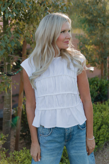 THE ANDREA RUCHED PEPLUM TOP IN WHITE