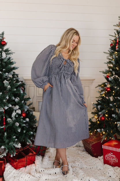 THE CORRIE STRIPE SMOCKED BOW DRESS IN GRAY