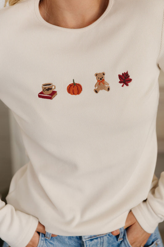 THE FALL EMBROIDERED GRAPHIC TOP IN CREAM