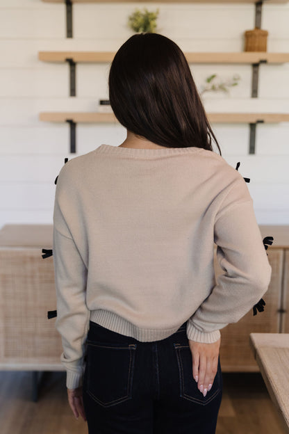 THE PENELOPE BOW SWEATER IN CREAM