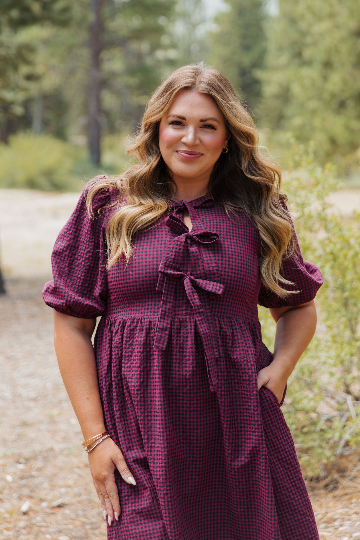 THE HARLOW BOW DRESS IN BURGUNDY CHECKERED BY PINK DESERT