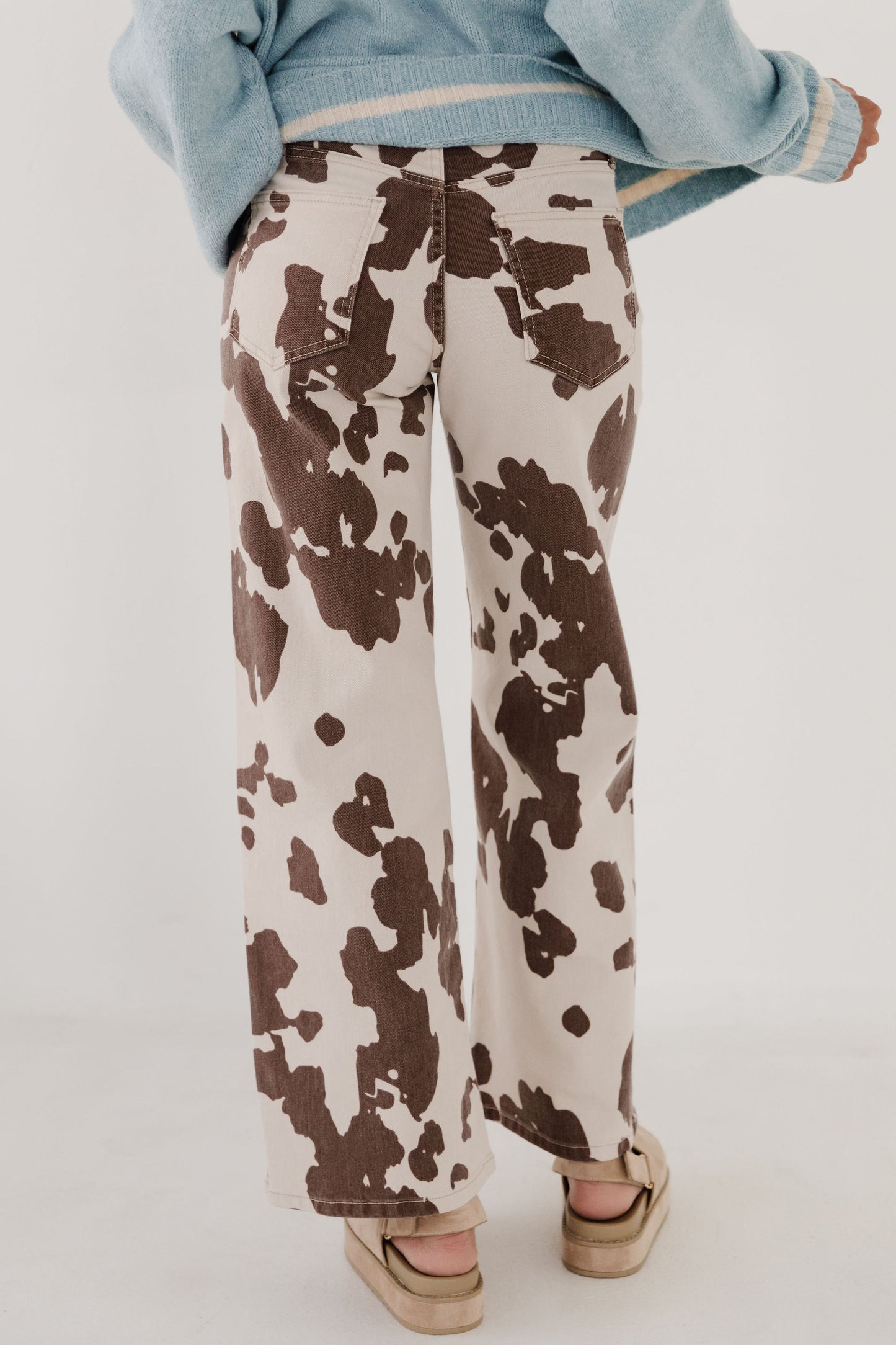 THE BESSIE COW PRINT JEANS IN CREAM
