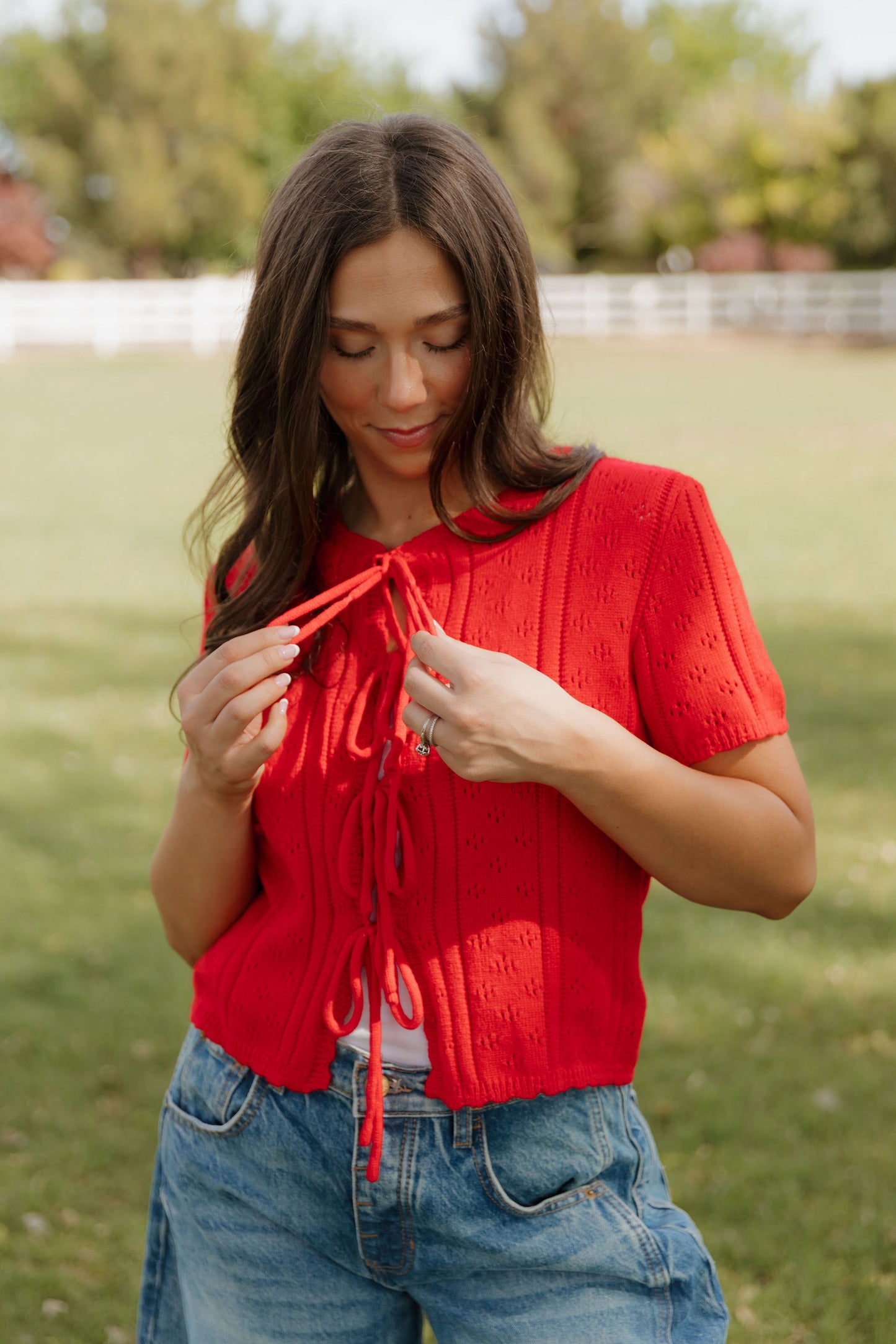 THE KAILEY TIE-FRONT KNIT TOP IN RED