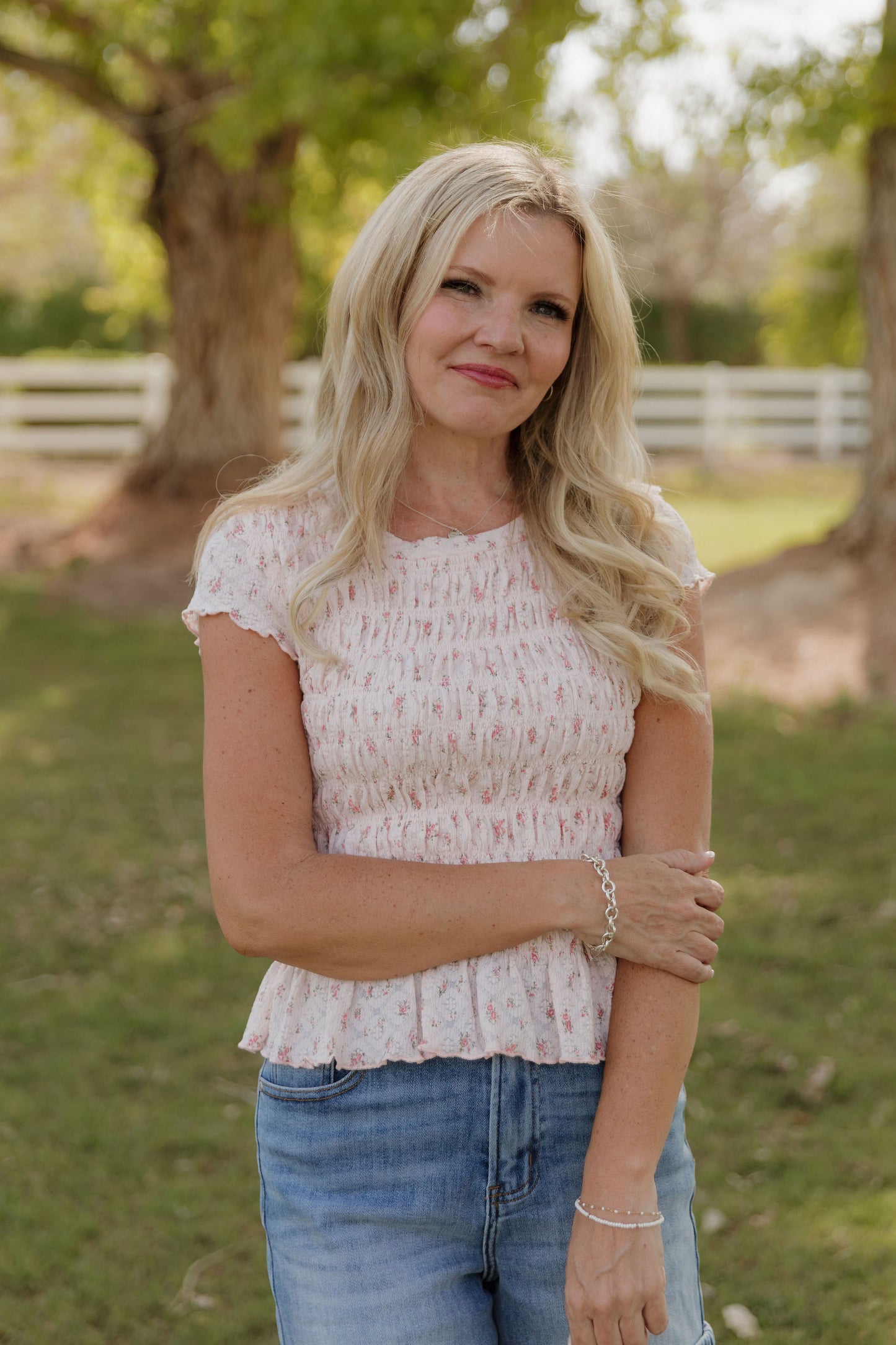 THE MADISON SMOCKED FLORAL TOP IN PINK