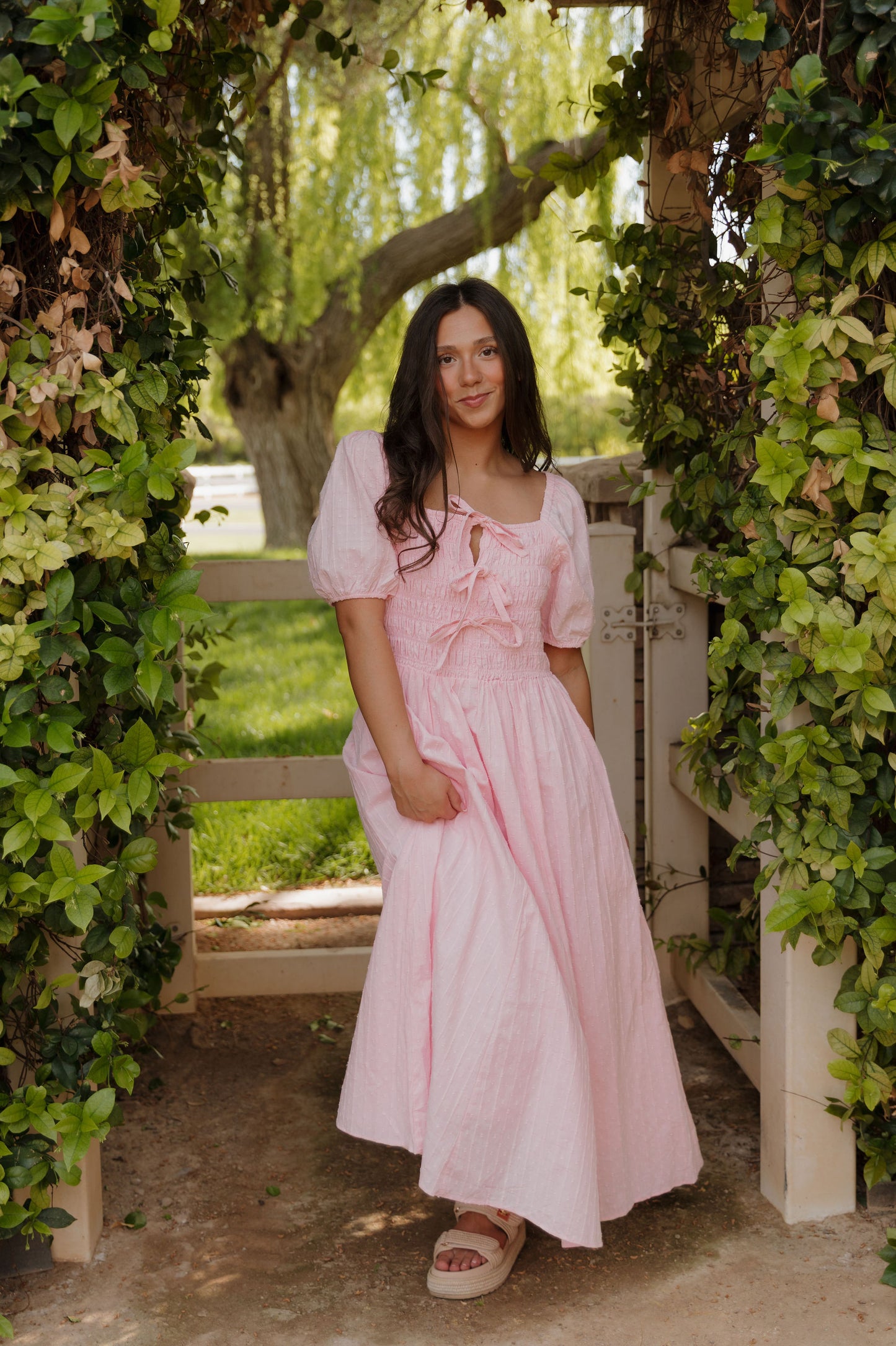 THE SUZANNAH BOW DETAIL DRESS IN PINK