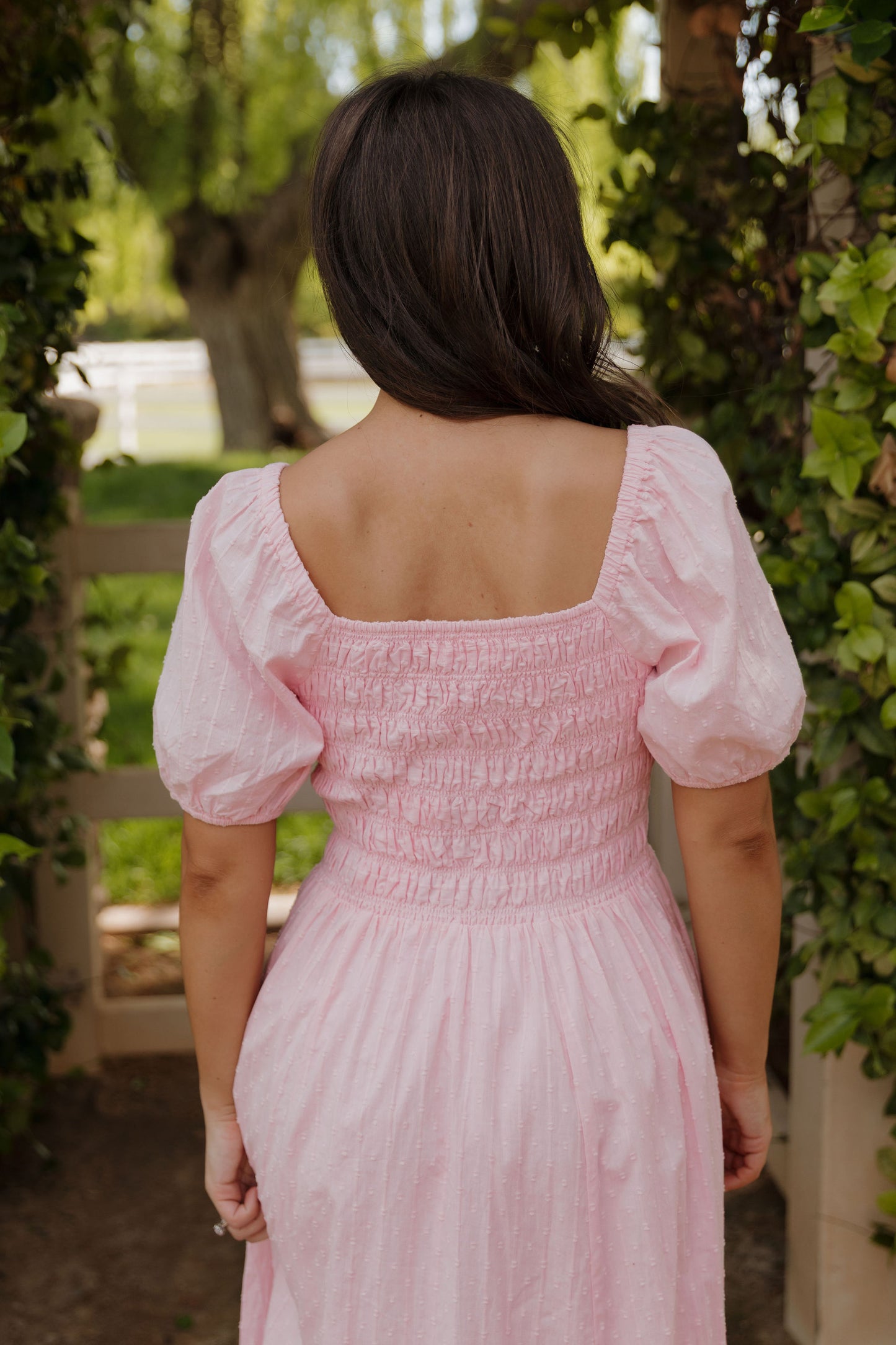 THE SUZANNAH BOW DETAIL DRESS IN PINK