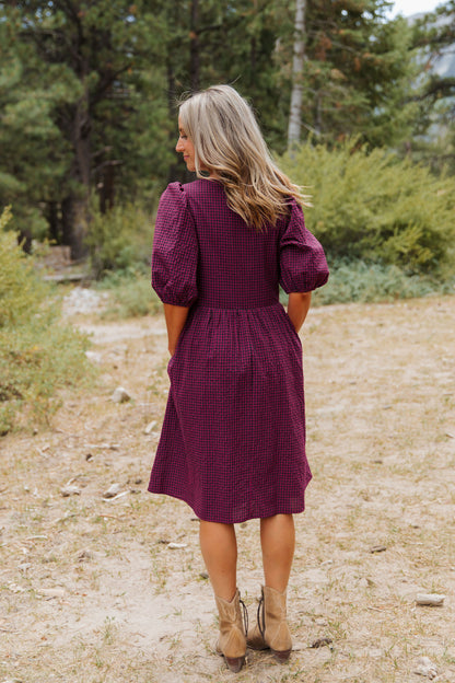THE HARLOW BOW DRESS IN BURGUNDY CHECKERED BY PINK DESERT