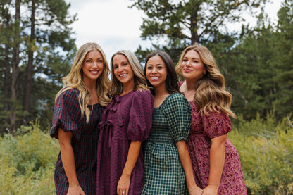 THE HARLOW BOW DRESS IN BURGUNDY CHECKERED BY PINK DESERT