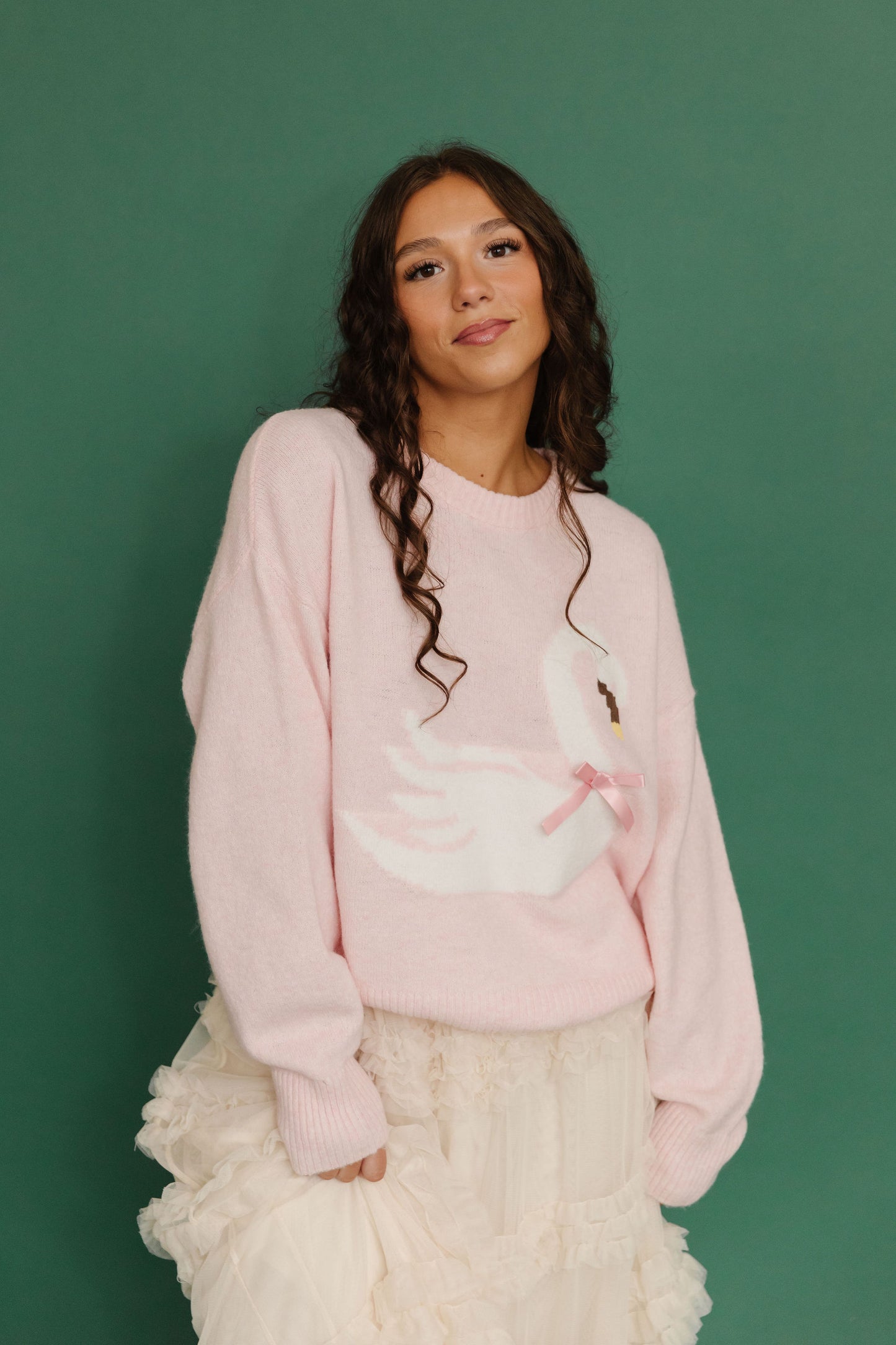 THE SWAN BOW GRAPHIC KNIT SWEATER IN PINK