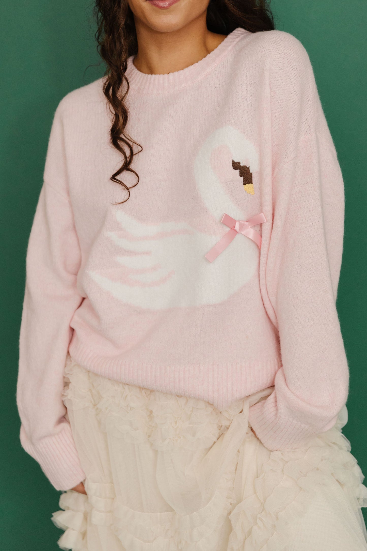 THE SWAN BOW GRAPHIC KNIT SWEATER IN PINK