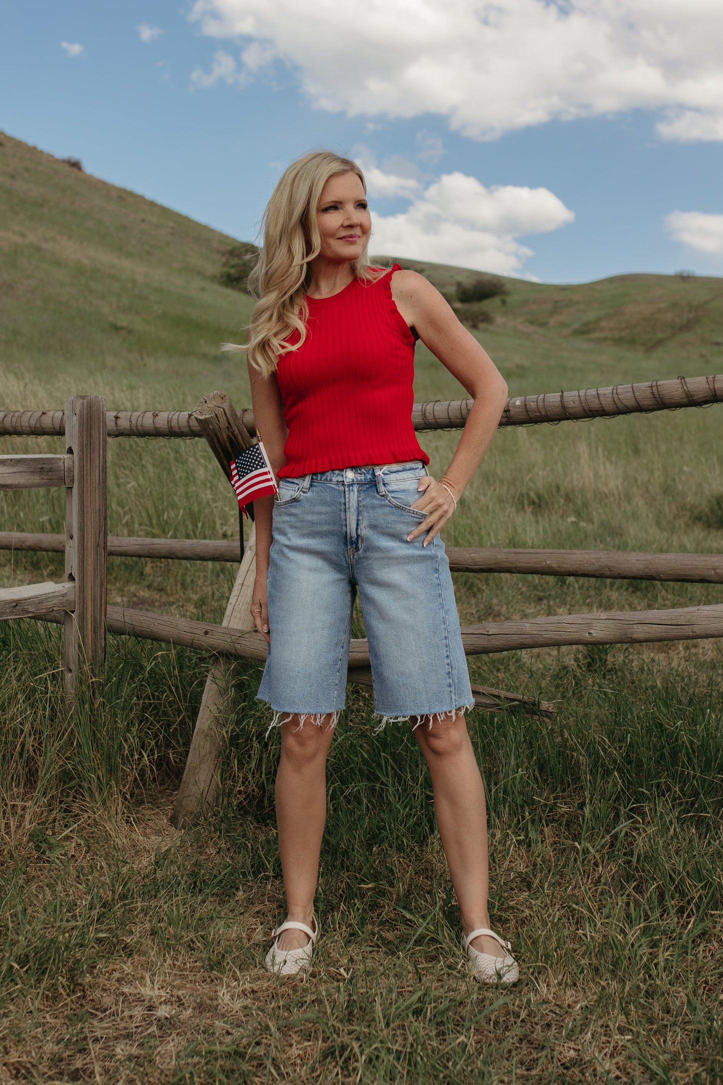 THE REMI SLEEVELESS FRILL TOP IN TOMATO RED