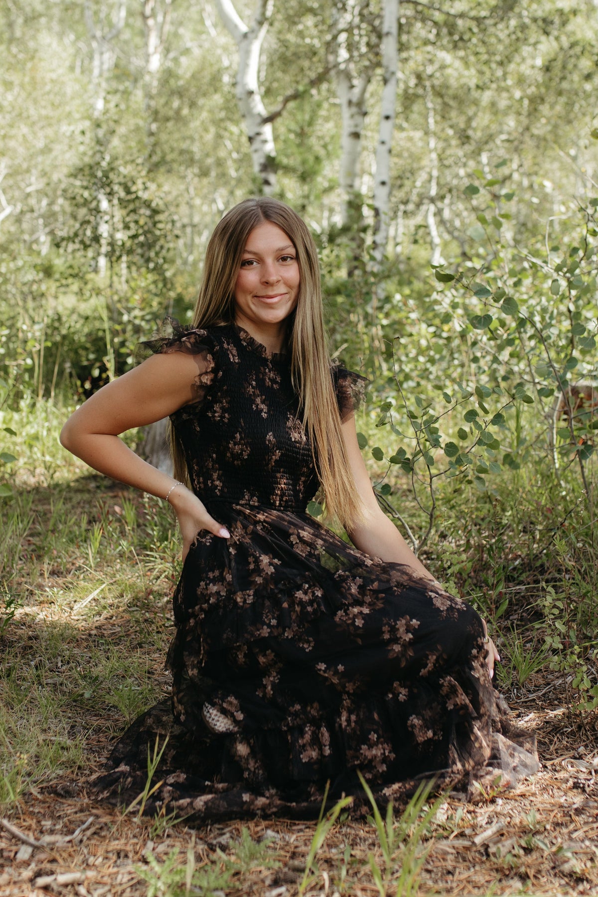 THE ADDISON FLORAL TIERED SMOCKED DRESS IN BLACK