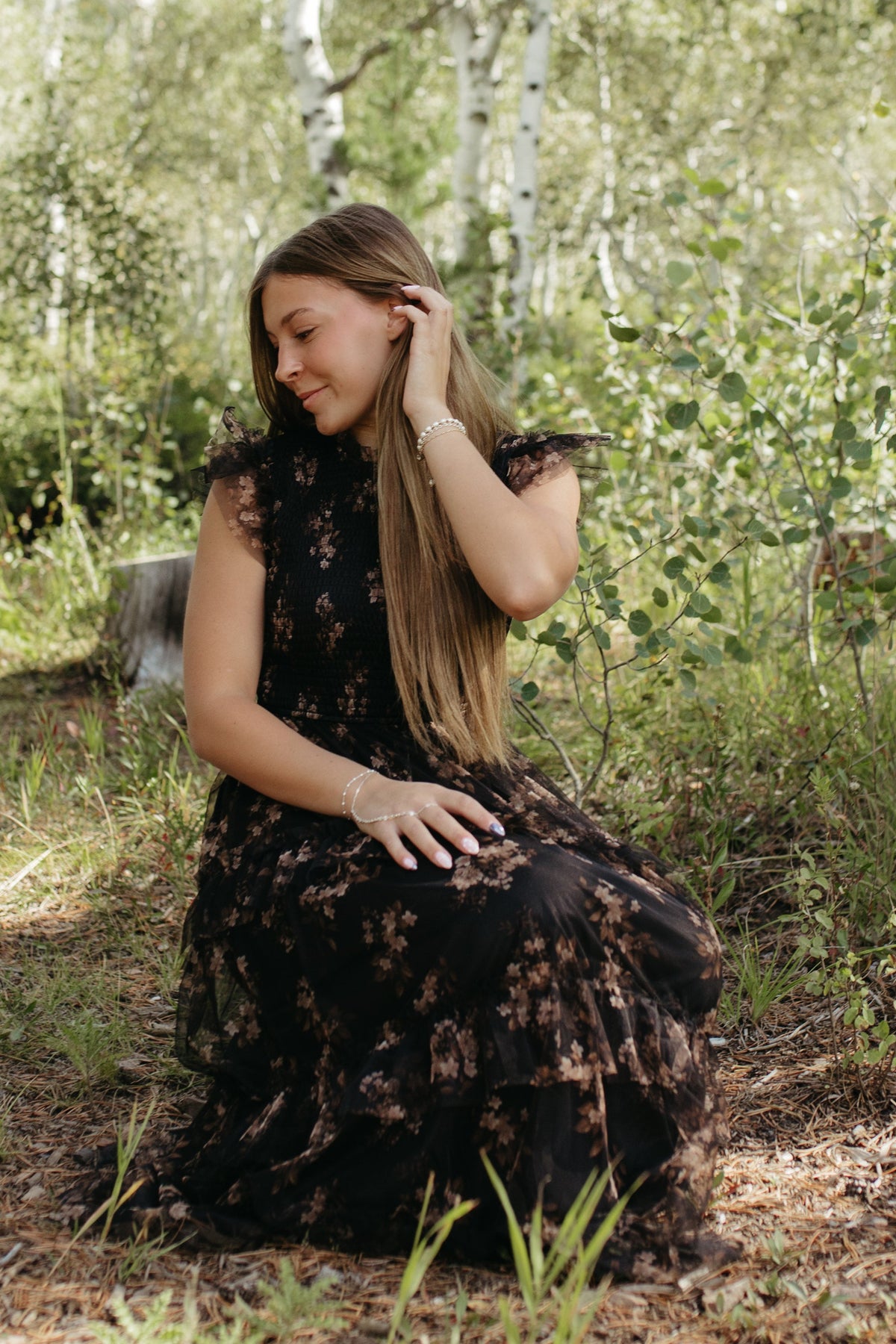 THE ADDISON FLORAL TIERED SMOCKED DRESS IN BLACK