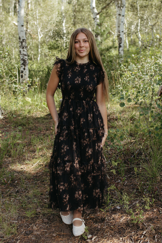 THE ADDISON FLORAL TIERED SMOCKED DRESS IN BLACK