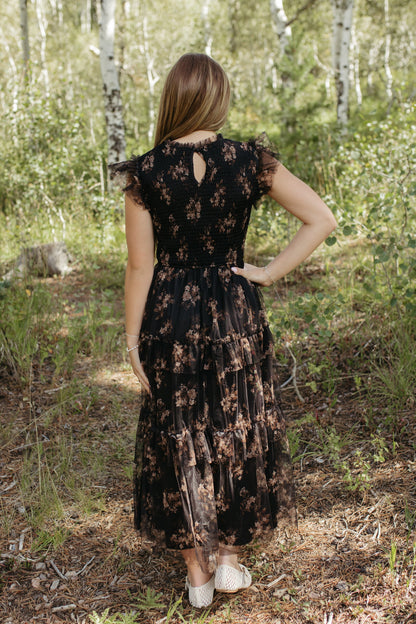 THE ADDISON FLORAL TIERED SMOCKED DRESS IN BLACK