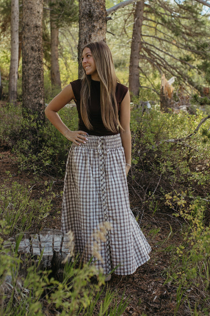 THE ARABELLA PLAID MIDI SMOCKED SKIRT IN LIGHT KHAKI