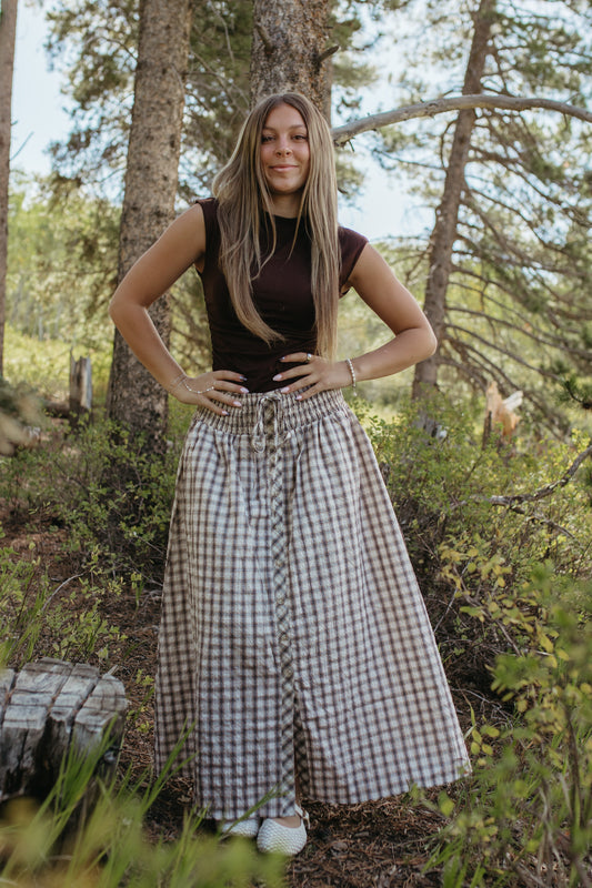 THE ARABELLA PLAID MIDI SMOCKED SKIRT IN LIGHT KHAKI