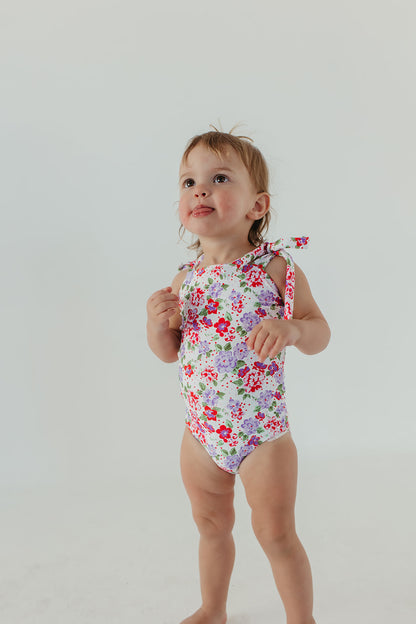 GIRLS TIE STRAP ONE PIECE IN CORAL BLOSSOM BY PINK DESERT X SARAH TRIPP